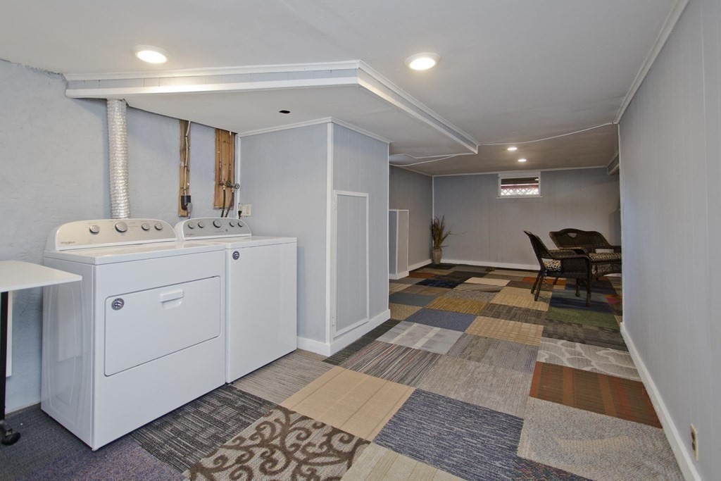 129 Eddy Street Springfield, MA 01104 - Photo 26 of 40 a room with gym equipment and mirrors