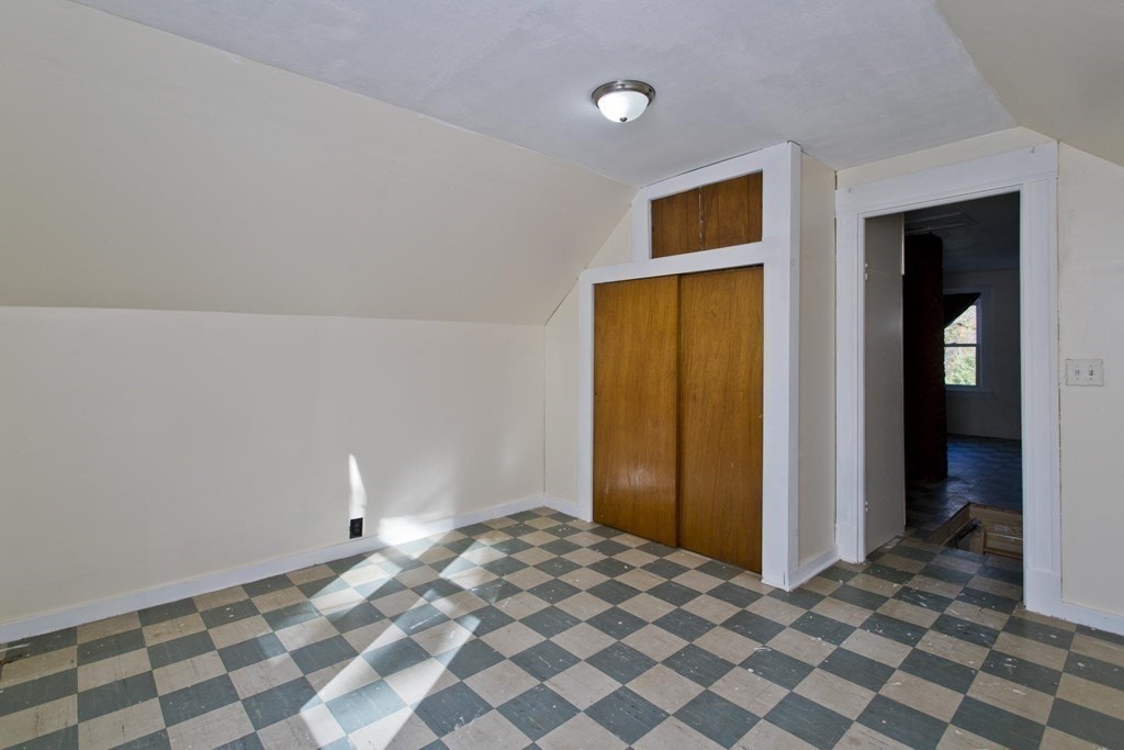 129 Eddy Street Springfield, MA 01104 - Photo 29 of 40 a bedroom with a bed and a cabinets