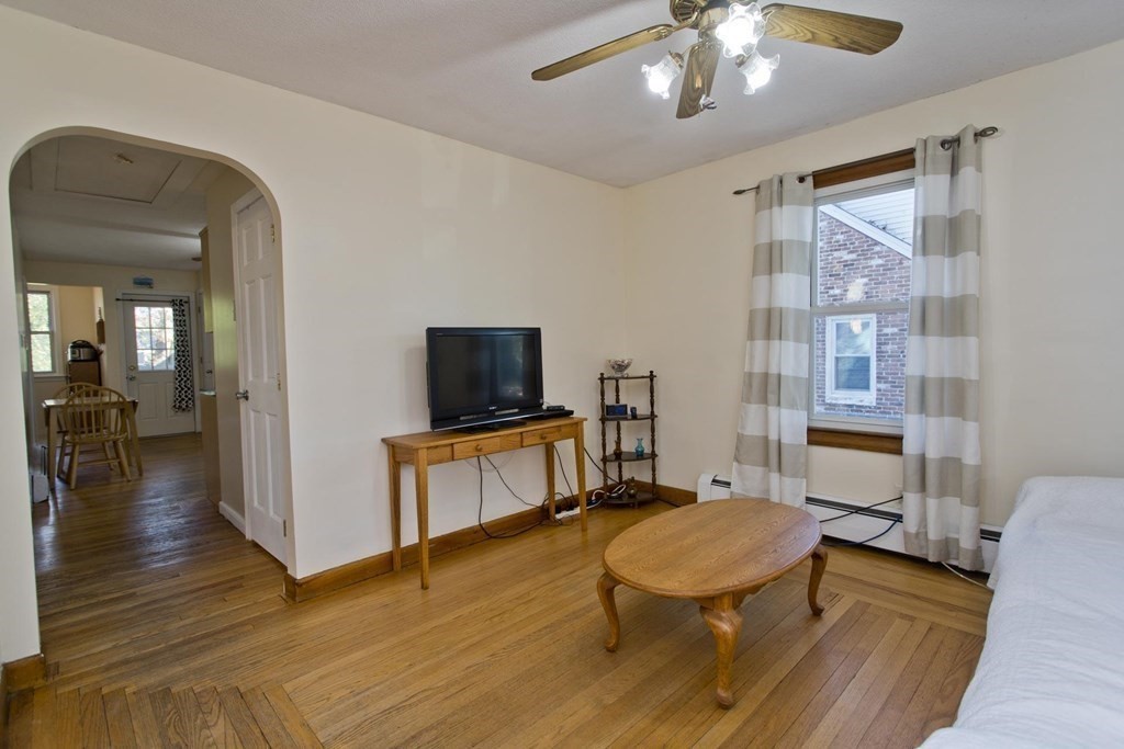 129 Eddy Street Springfield, MA 01104 - Photo 6 of 40 a living room with furniture and a flat screen tv