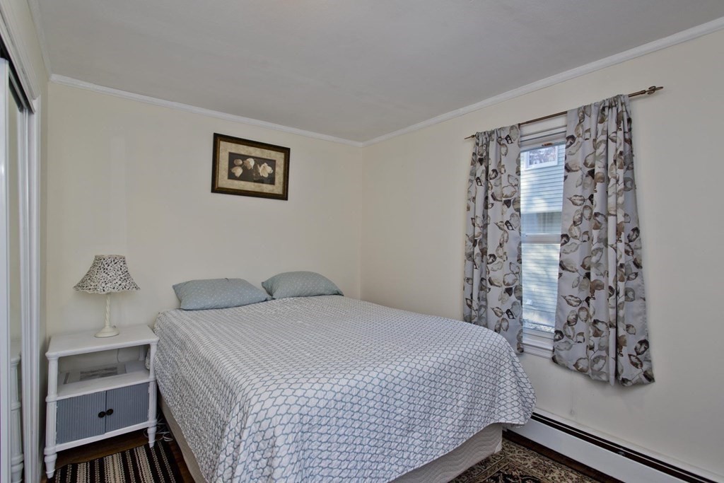 129 Eddy Street Springfield, MA 01104 - Photo 8 of 40 a bedroom with a bed and a window
