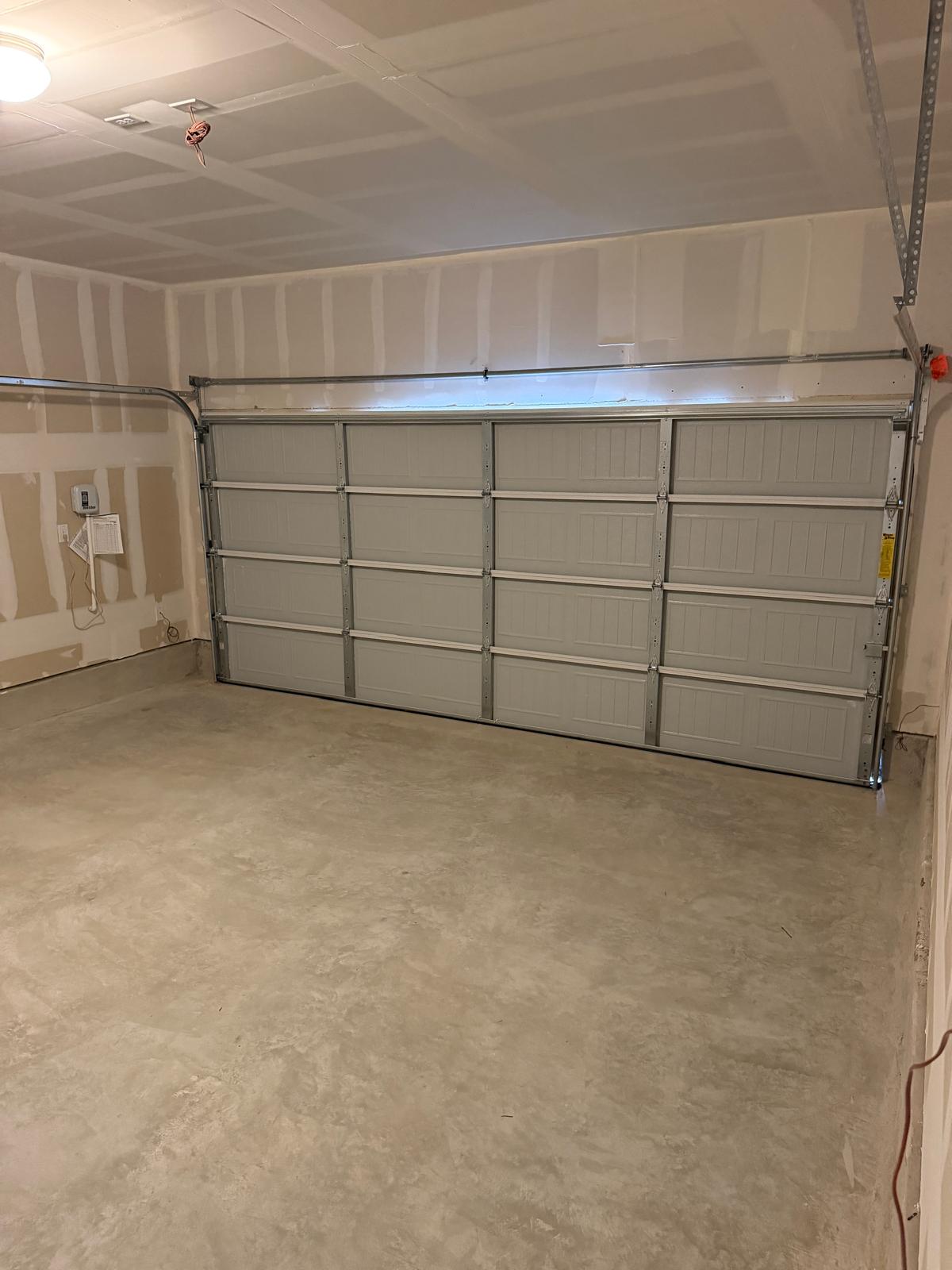 2701 Towy Road Manor, TX 78653 - Photo 35 of 35 A spacious, newly finished garage offers ample room and a secure parking solution.
