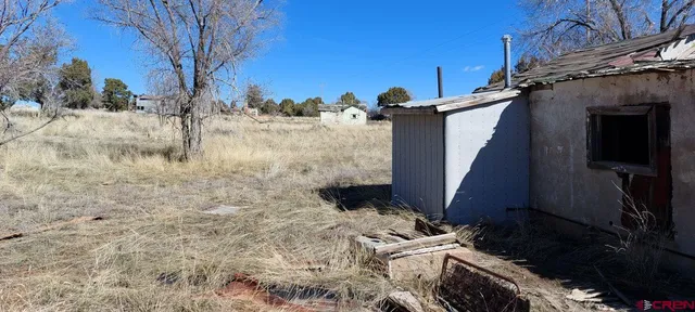 a view of a house with a snow in the yard
