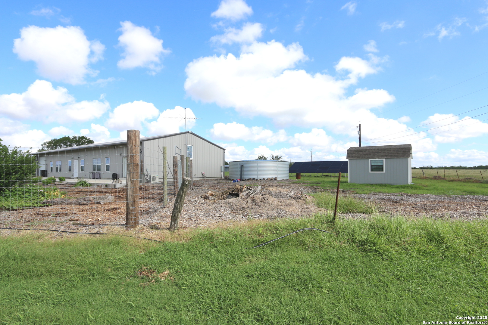 a backyard of a house with lots of green space