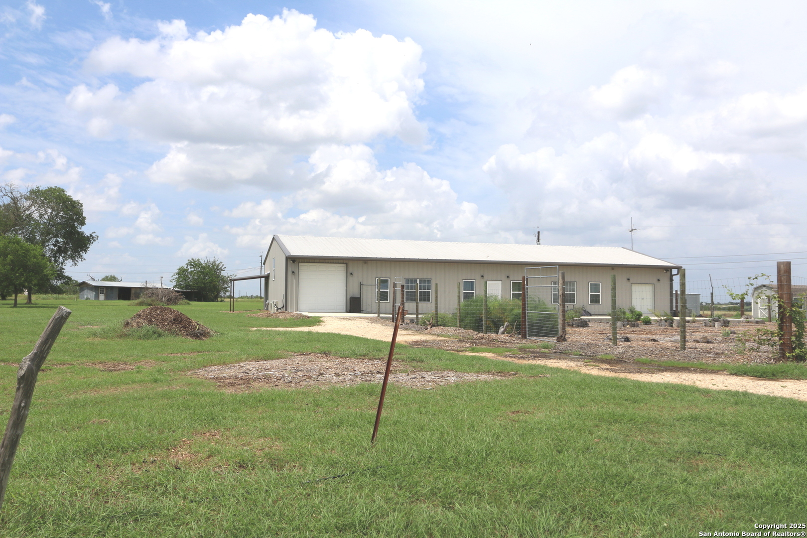 1221 North Santa Clara Road Marion, TX 78124 - Photo 2 of 55 a view of a house with a yard and sitting area
