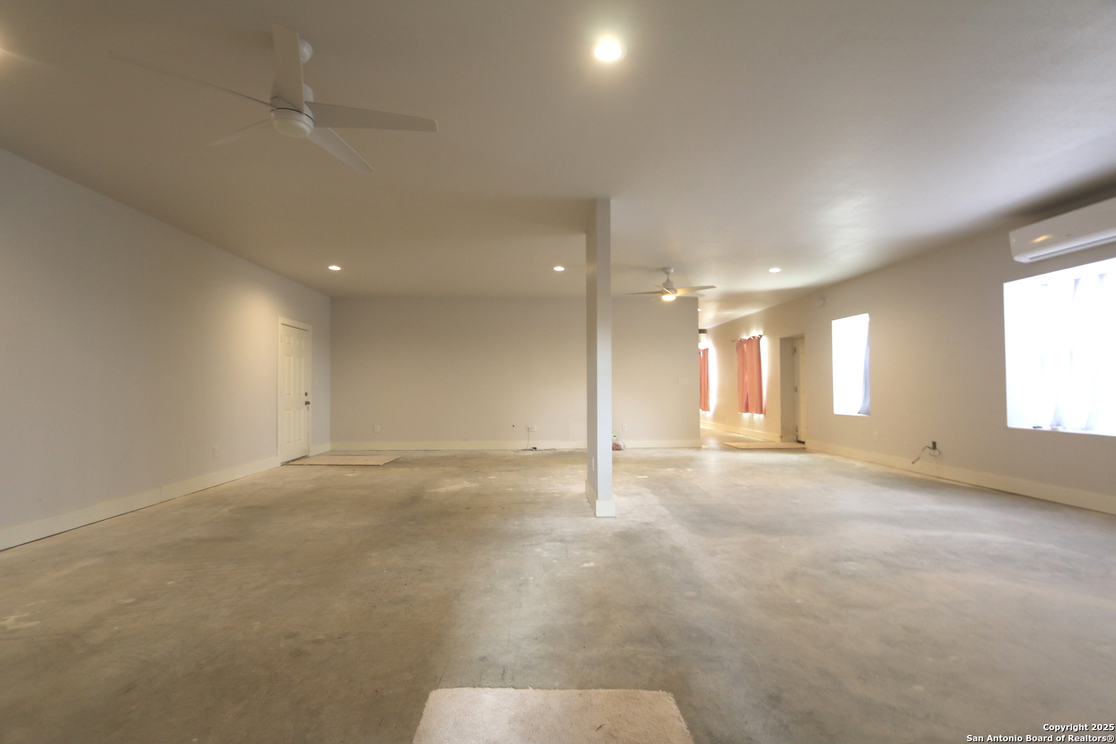 1221 North Santa Clara Road Marion, TX 78124 - Photo 23 of 55 an empty room with a empty space and windows