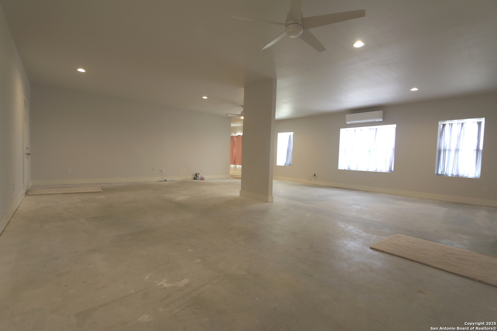 1221 North Santa Clara Road Marion, TX 78124 - Photo 24 of 55 an empty room with windows and entrance