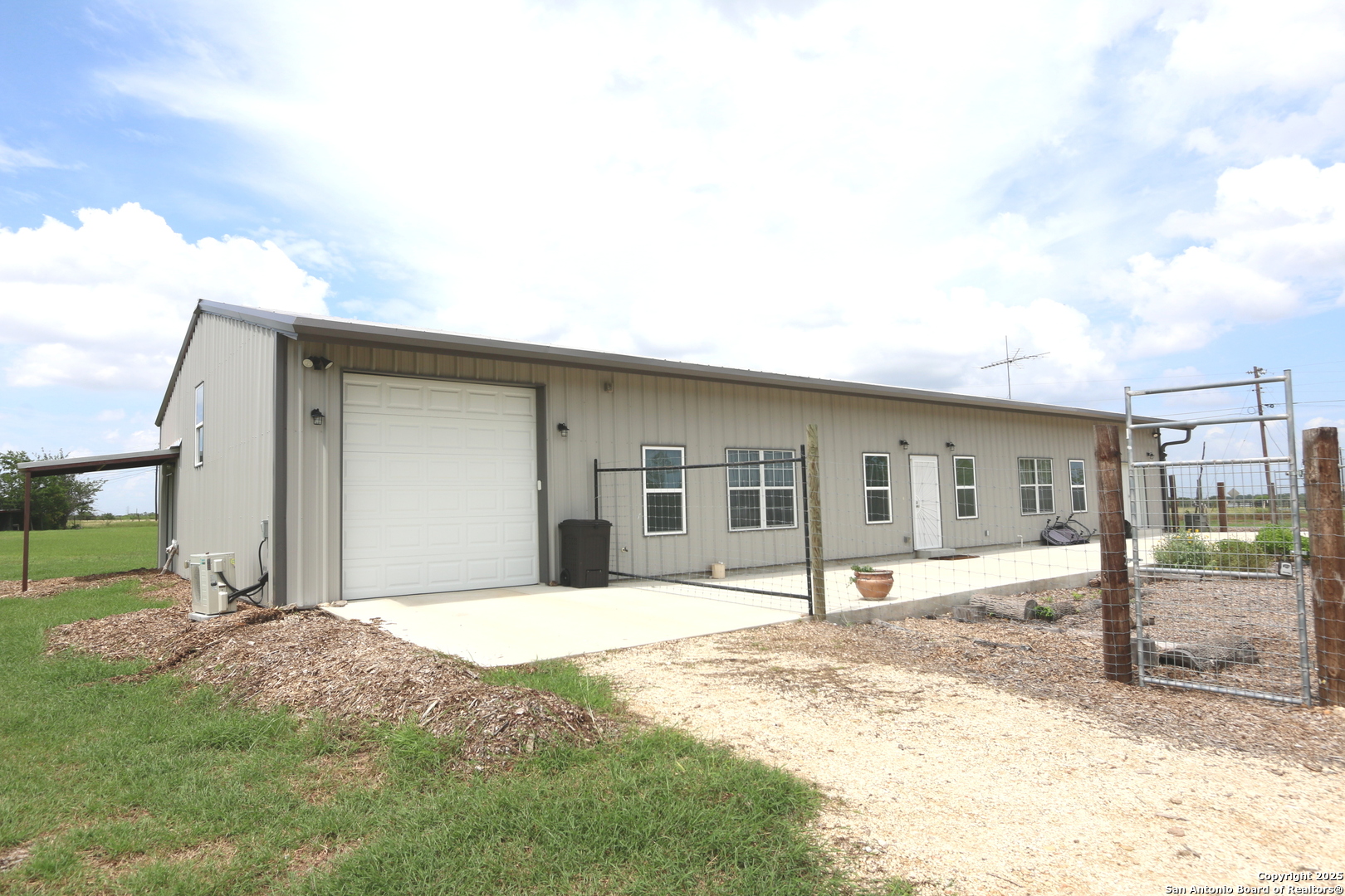 1221 North Santa Clara Road Marion, TX 78124 - Photo 3 of 55 a front view of a house with a yard