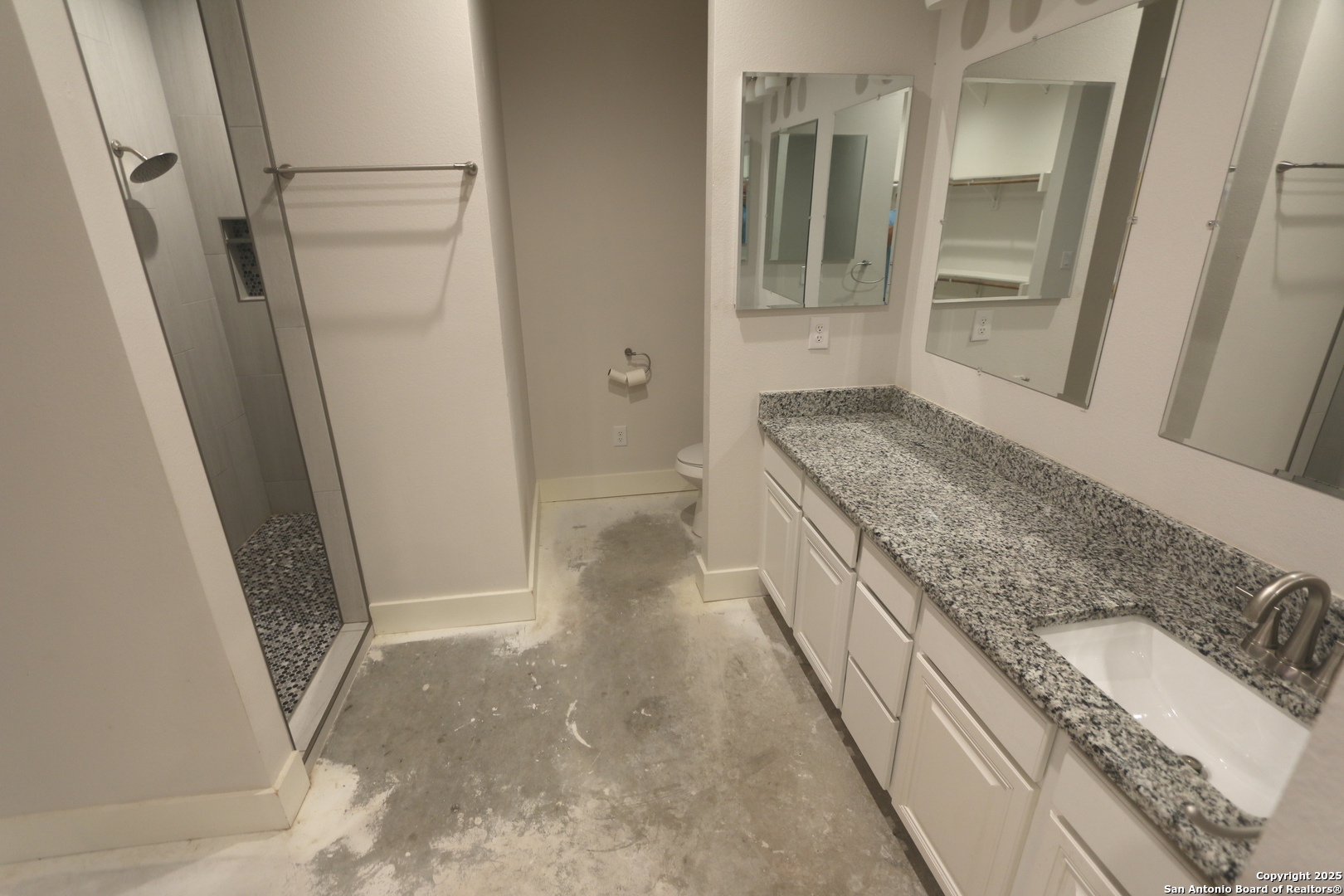 1221 North Santa Clara Road Marion, TX 78124 - Photo 32 of 55 a bathroom with a granite countertop sink and a granite counter top