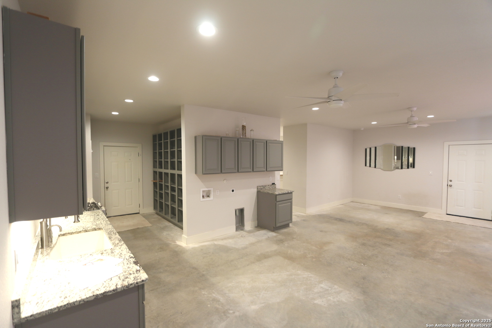 1221 North Santa Clara Road Marion, TX 78124 - Photo 33 of 55 a living room with stainless steel appliances kitchen island granite countertop a sink and cabinets
