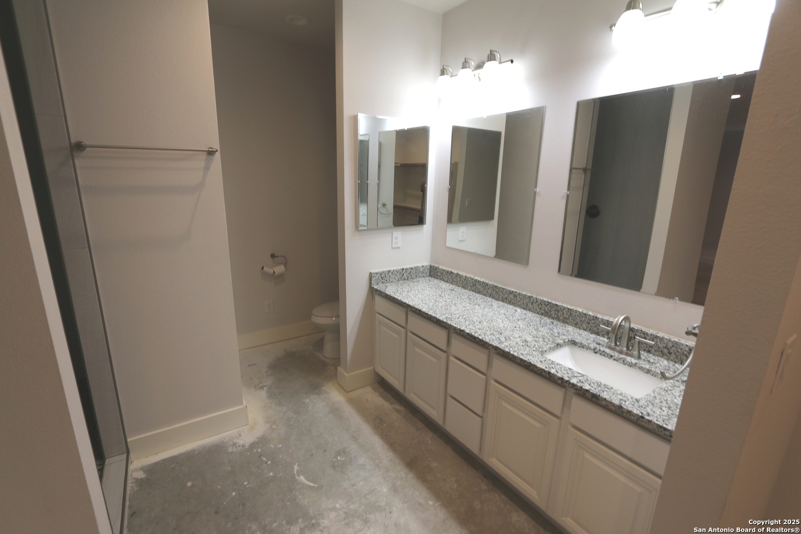 1221 North Santa Clara Road Marion, TX 78124 - Photo 34 of 55 a bathroom with a double vanity sink and mirror