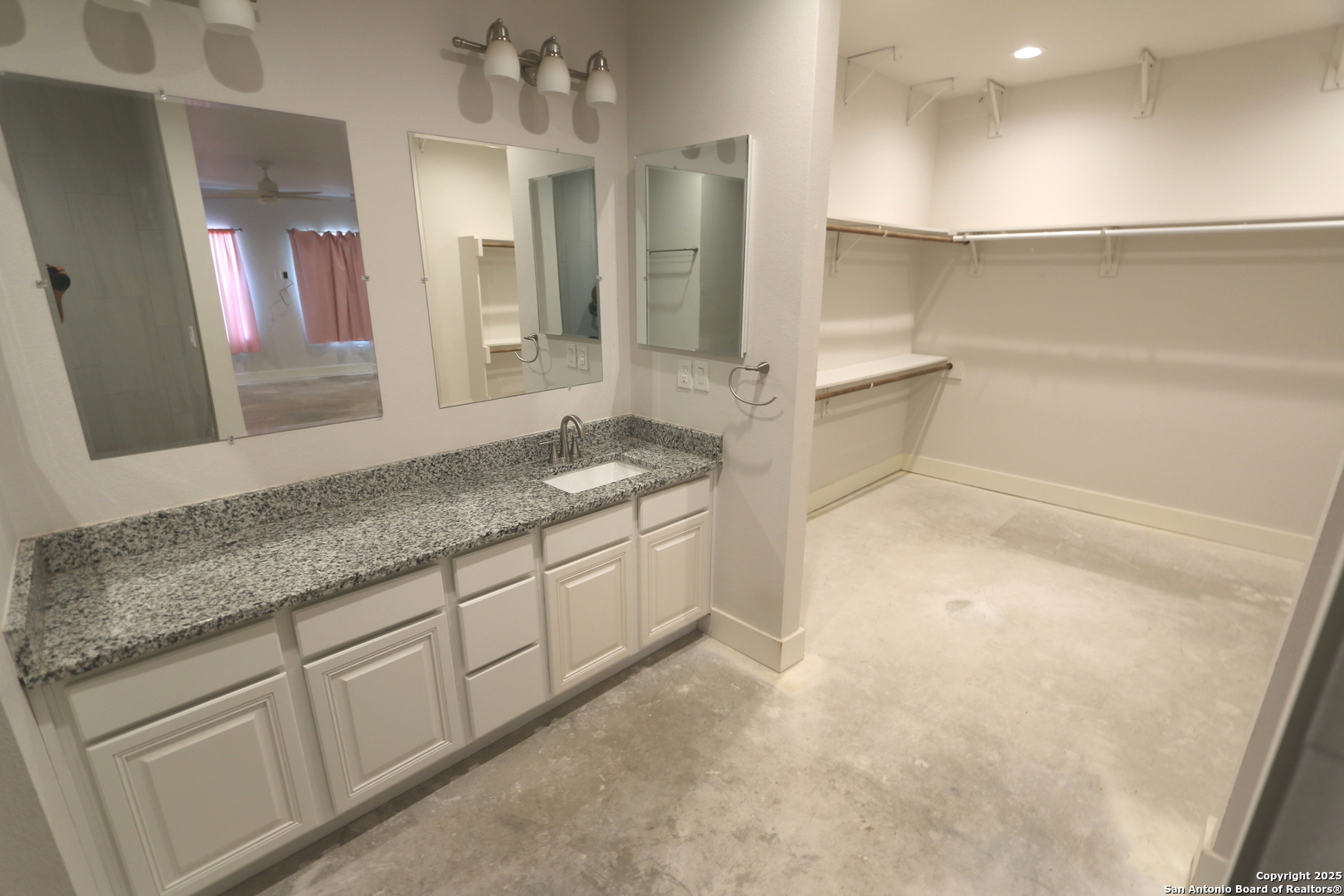 1221 North Santa Clara Road Marion, TX 78124 - Photo 35 of 55 a bathroom with a granite countertop sink and a mirror