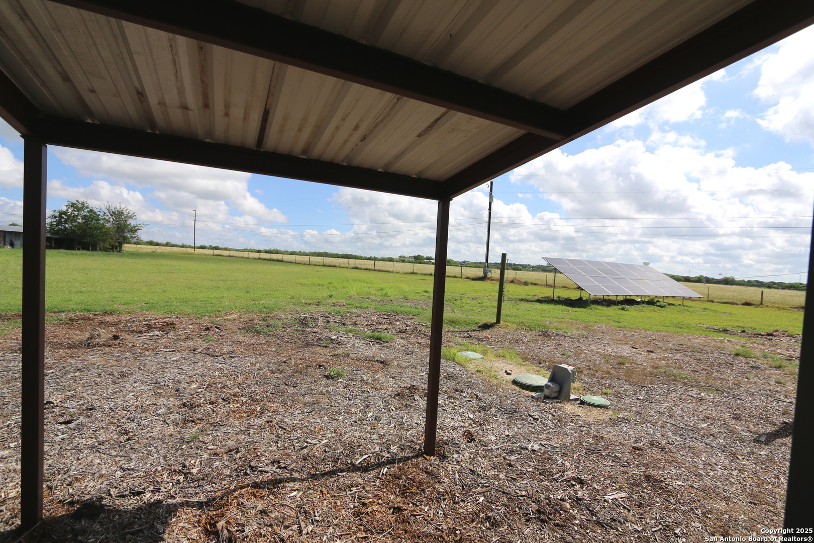 1221 North Santa Clara Road Marion, TX 78124 - Photo 44 of 55 a view of a backyard with a big yard