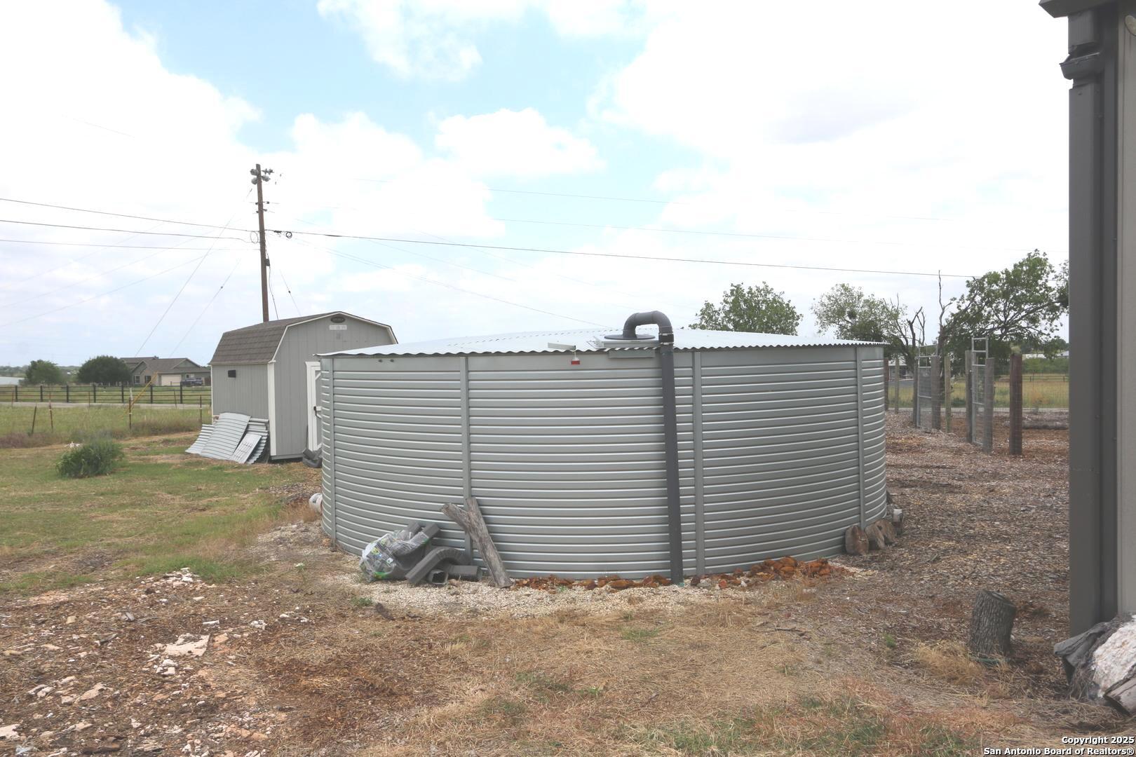 1221 North Santa Clara Road Marion, TX 78124 - Photo 7 of 55 a view of a dry yard with wooden fence
