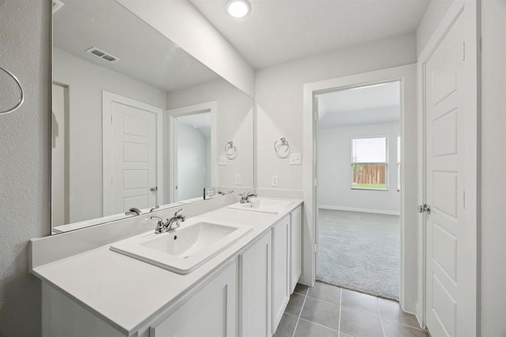 15033 Santoscoy Street Haslet, TX 76052 - Photo 14 of 27 Primary Bathroom in the Hadley home plan by Trophy Signature Homes – REPRESENTATIVE PHOTO