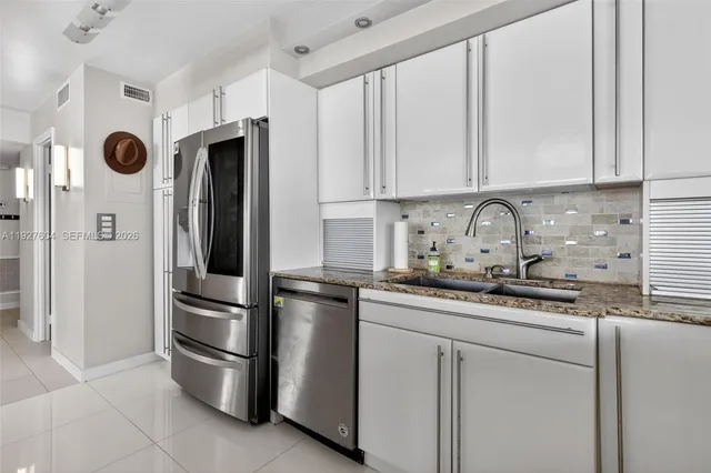 a spacious bathroom with a sink and a mirror