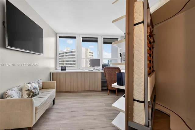 a bathroom with a refrigerator and a sink
