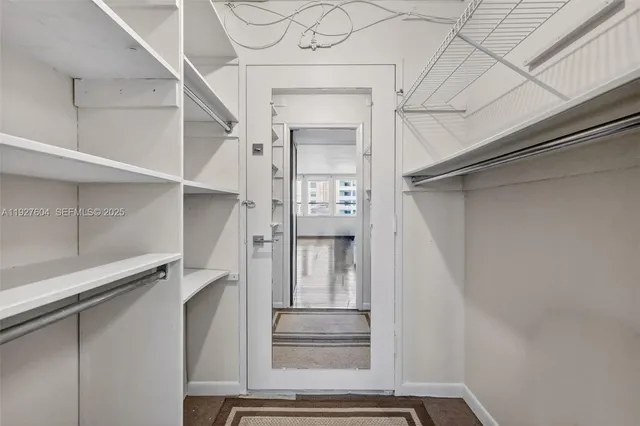 a view of a hallway with washer and dryer