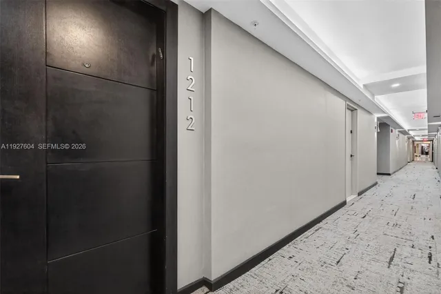 a view of a hallway with closet