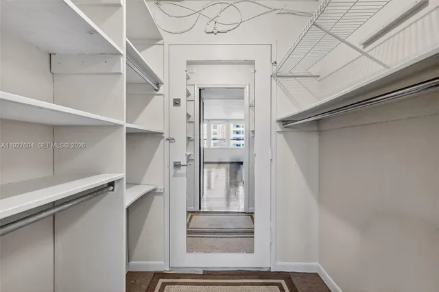 a view of a hallway with washer and dryer
