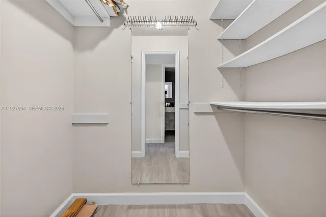 a view of a kitchen with a sink and cabinets