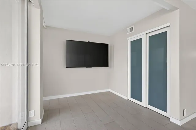 wooden floor and windows in an empty room