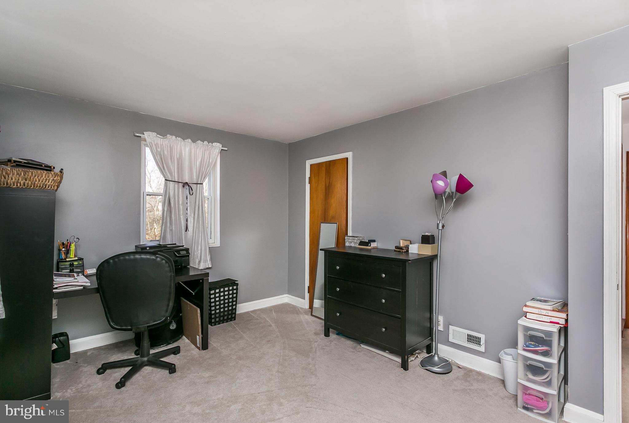 6623 Pheasant Road Baltimore, MD 21220 - Photo 14 of 27 a view of a workspace with furniture and a window