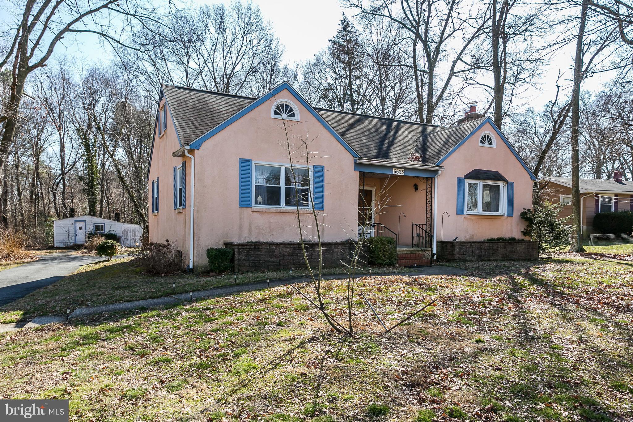 6623 Pheasant Road Baltimore, MD 21220 - Photo 3 of 27 a front view of a house with a yard
