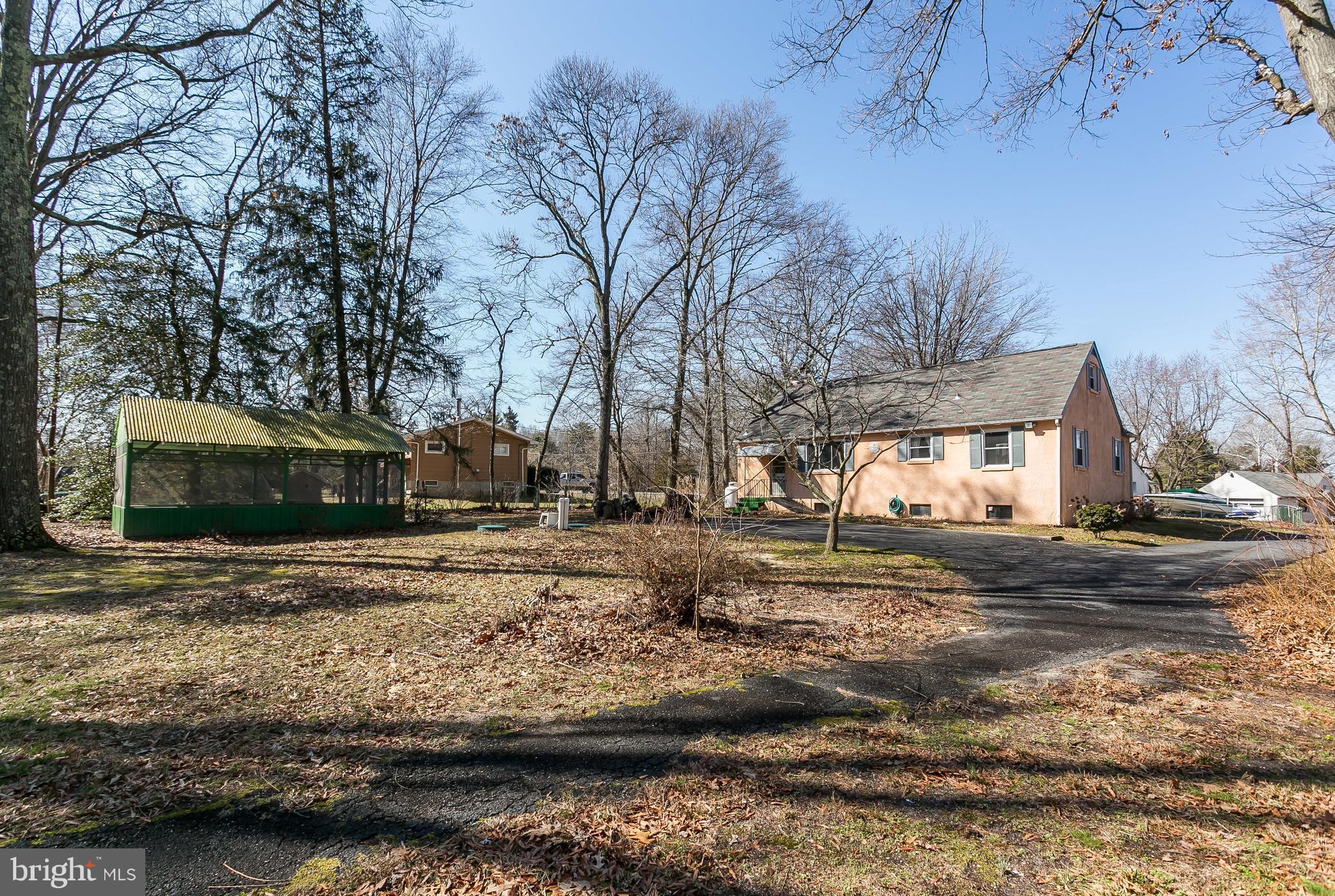 6623 Pheasant Road Baltimore, MD 21220 - Photo 22 of 27 a view of street with large trees