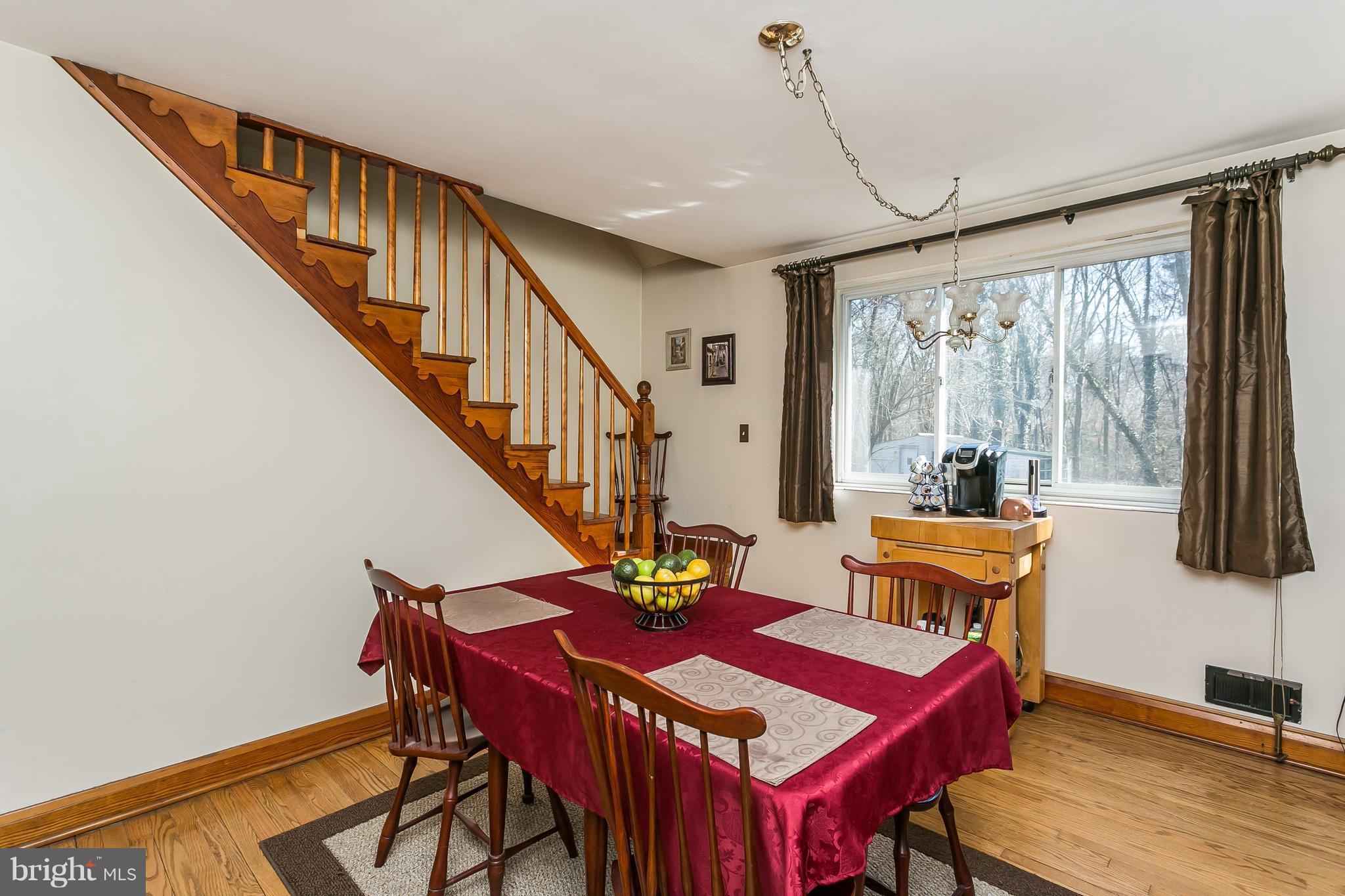 6623 Pheasant Road Baltimore, MD 21220 - Photo 8 of 27 a view of a dining room with furniture window and wooden floor