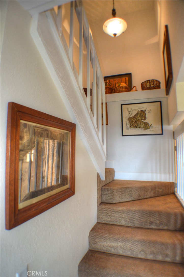146 Avenida Baja San Clemente, CA 92672 - Photo 29 of 41 a view of staircase with a ceiling fan and a window