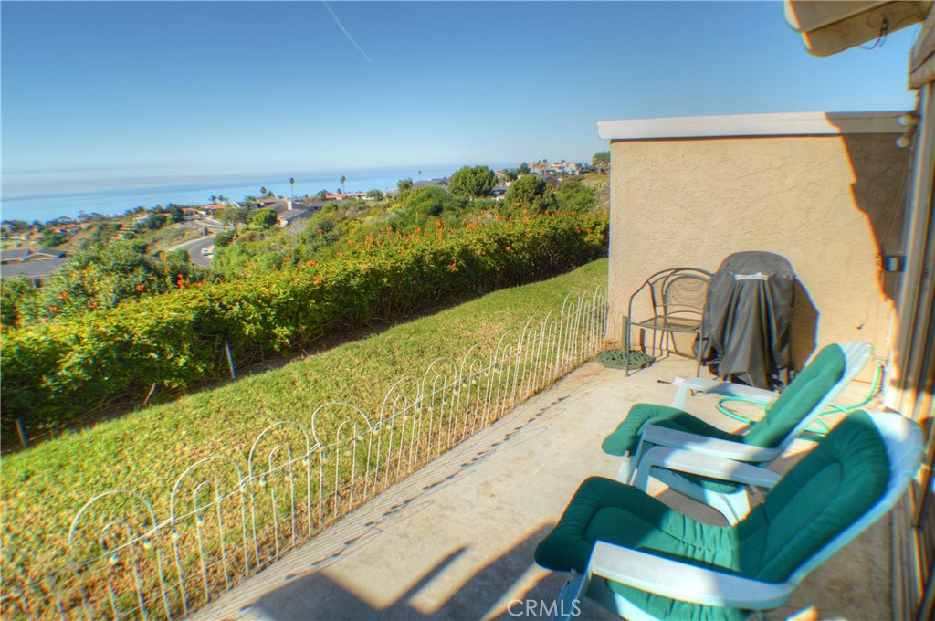 146 Avenida Baja San Clemente, CA 92672 - Photo 3 of 41 a view of a balcony with chair and wooden floor