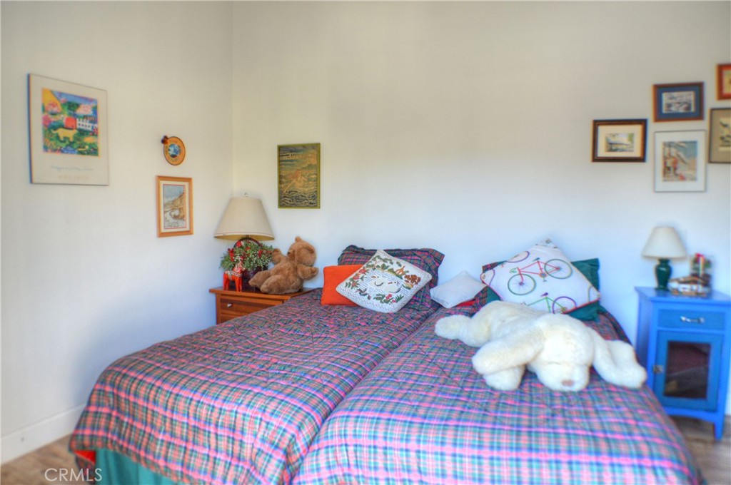 146 Avenida Baja San Clemente, CA 92672 - Photo 35 of 41 a bedroom with bed and cupboard