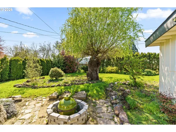 a view of a garden with a fountain