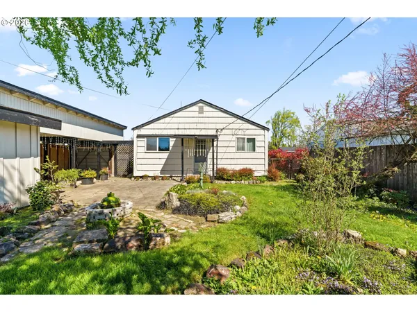 a front view of a house with garden