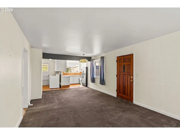 a view of a livingroom with a kitchen