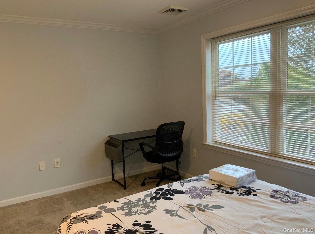 115 A High Street Peekskill, NY 10566 - Photo 16 of 17 a bedroom with a bed and a window