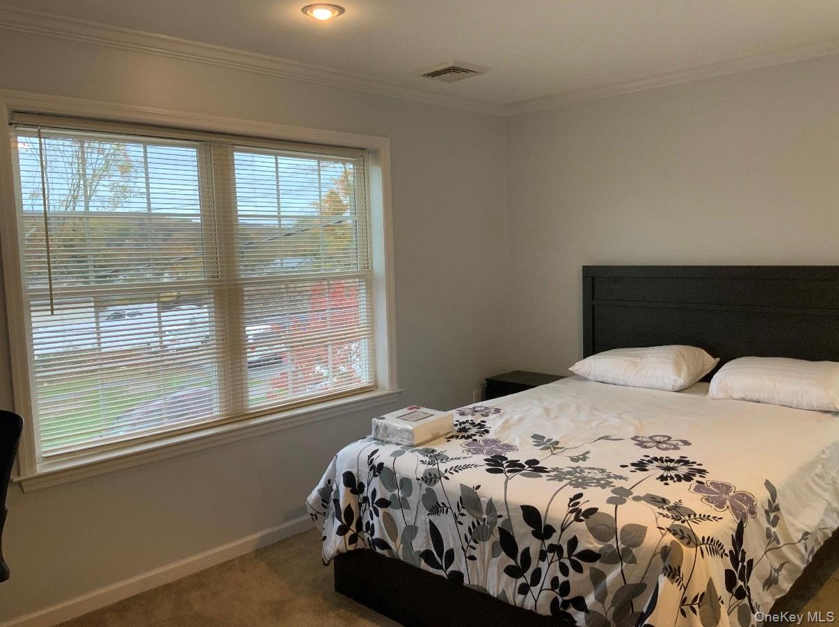 115 A High Street Peekskill, NY 10566 - Photo 17 of 17 a bedroom with a bed and a window