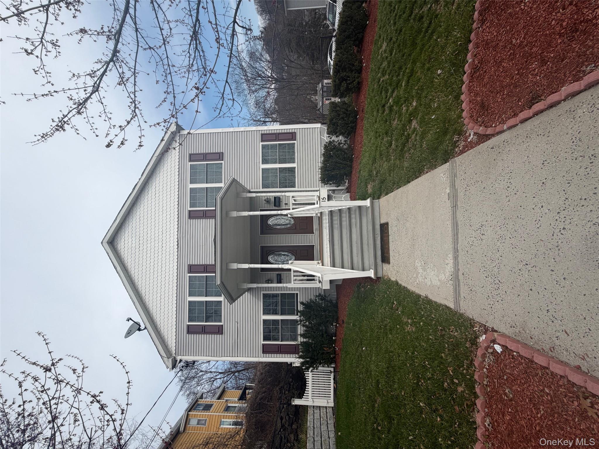 115 A High Street Peekskill, NY 10566 - Photo 2 of 17 a front view of a house with a yard