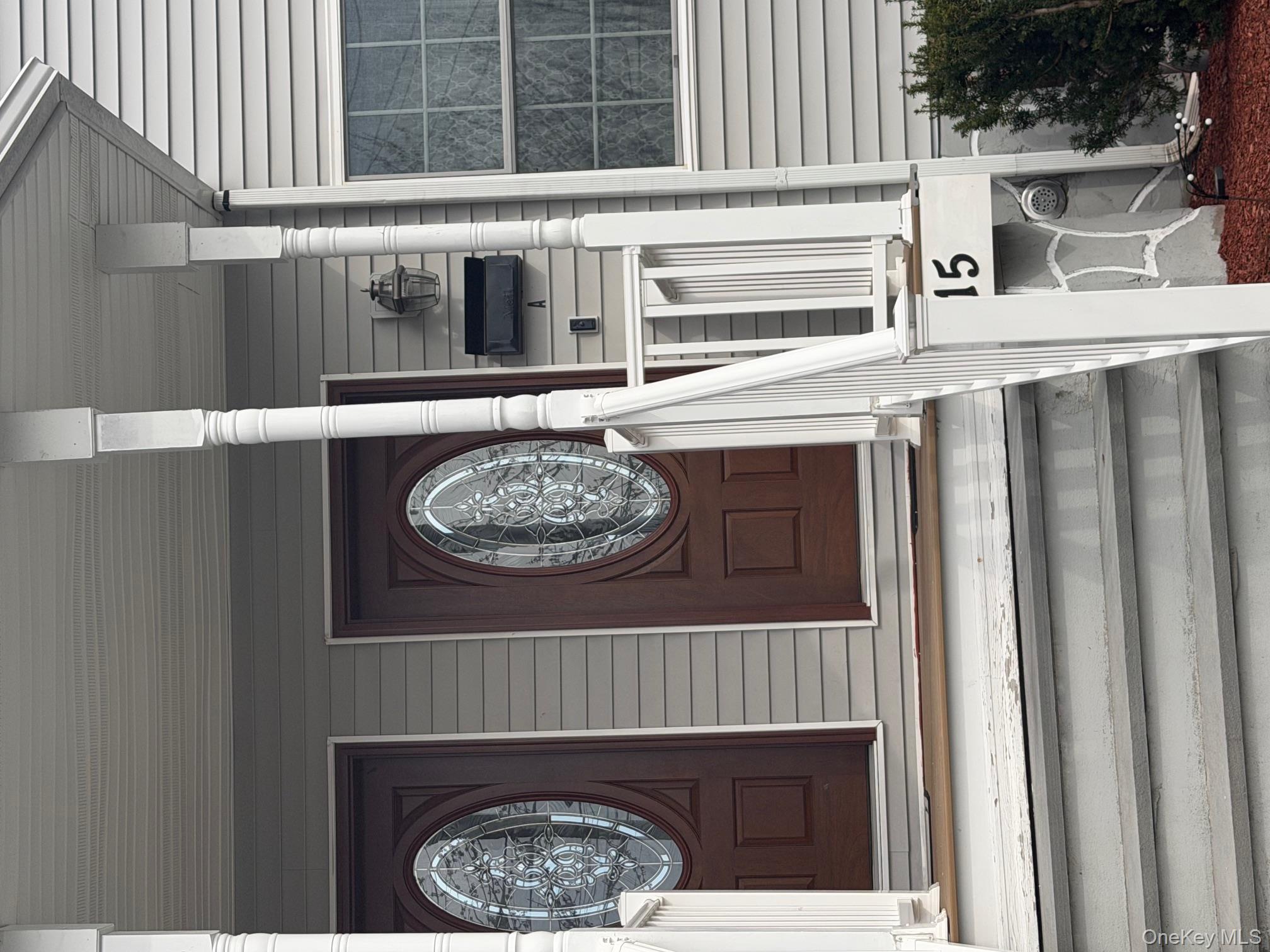 115 A High Street Peekskill, NY 10566 - Photo 3 of 17 a view of a fireplace with a clock on walls