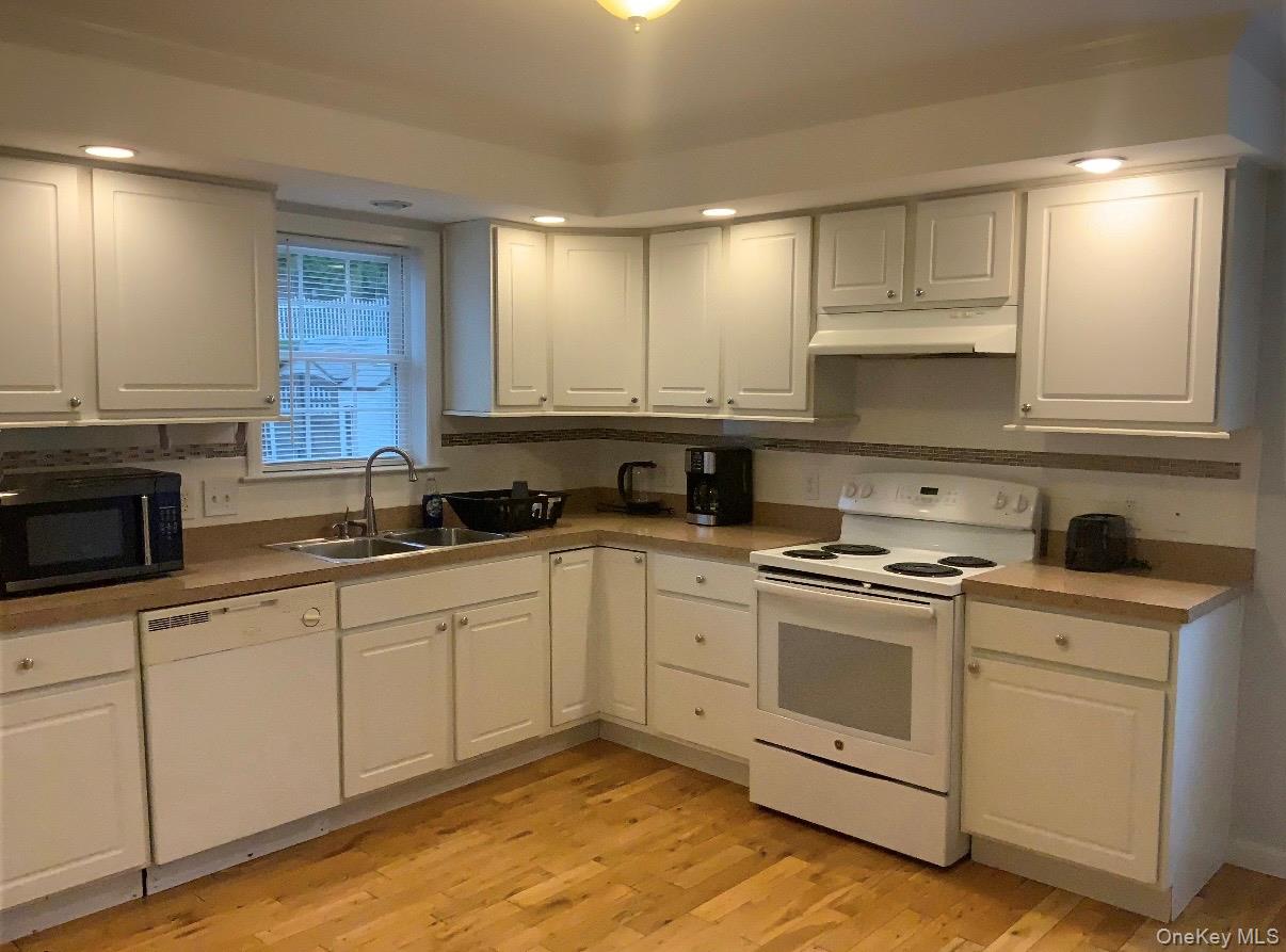115 A High Street Peekskill, NY 10566 - Photo 5 of 17 a kitchen with cabinets appliances and a sink