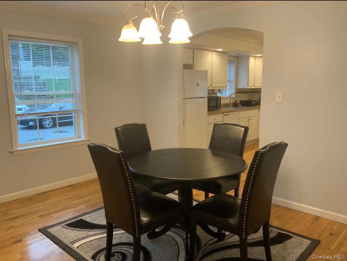 115 A High Street Peekskill, NY 10566 - Photo 8 of 17 a view of a dining room with furniture and wooden floor