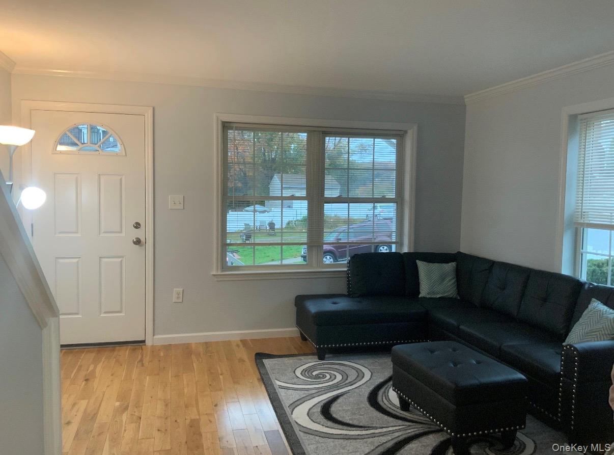 115 A High Street Peekskill, NY 10566 - Photo 9 of 17 a living room with furniture and a window