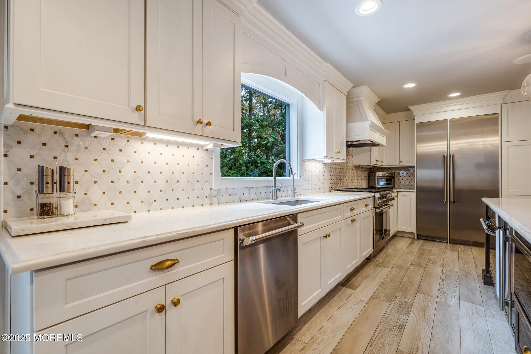 4 Garnet Street Morganville, NJ 07751 - Photo 13 of 70 a kitchen with granite countertop a sink stainless steel appliances and cabinets