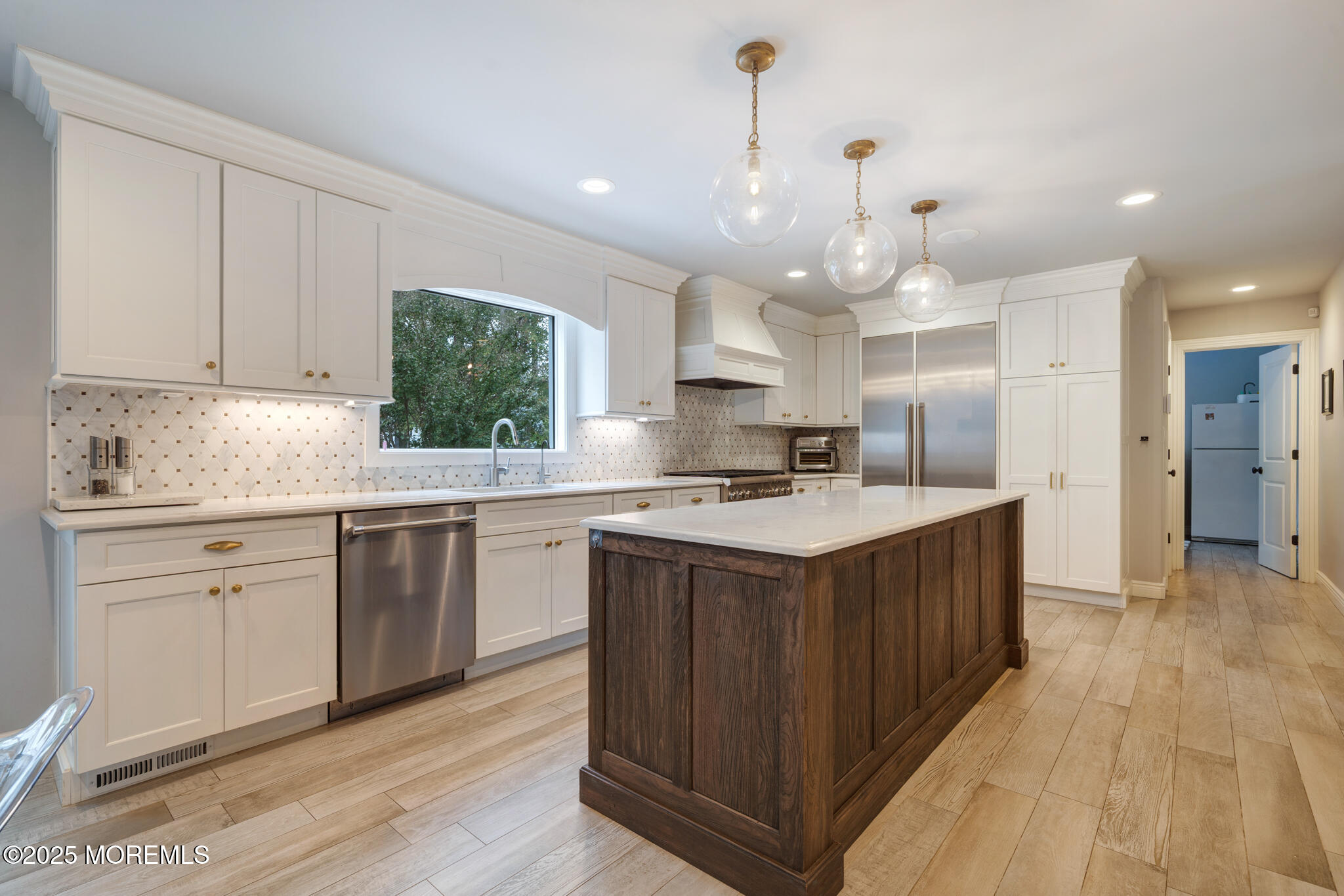 4 Garnet Street Morganville, NJ 07751 - Photo 14 of 70 a kitchen with kitchen island granite countertop a sink cabinets and stainless steel appliances