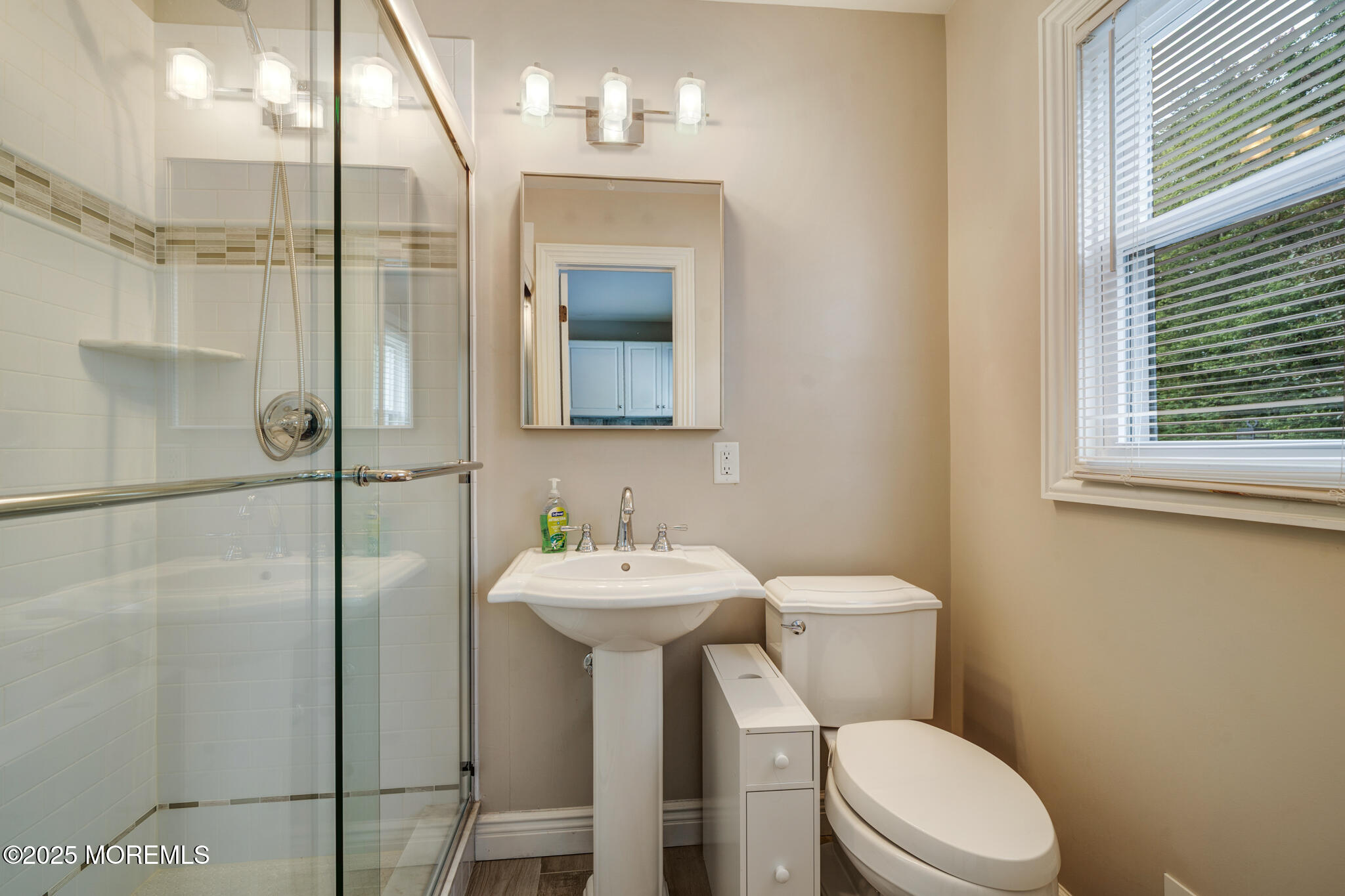 4 Garnet Street Morganville, NJ 07751 - Photo 18 of 70 a bathroom with a sink mirror toilet and shower