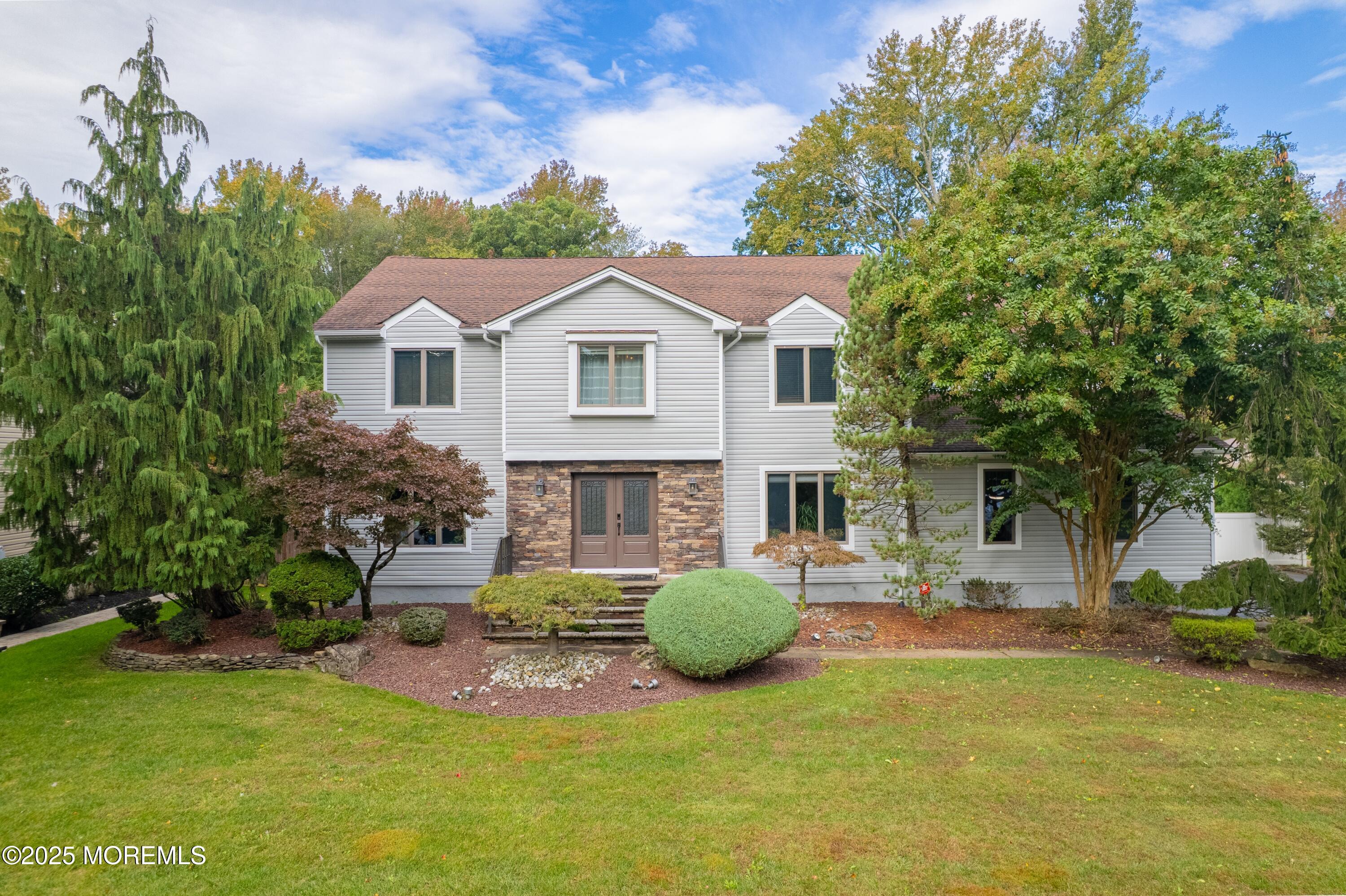 4 Garnet Street Morganville, NJ 07751 - Photo 2 of 70 a view of a house with backyard and sitting area