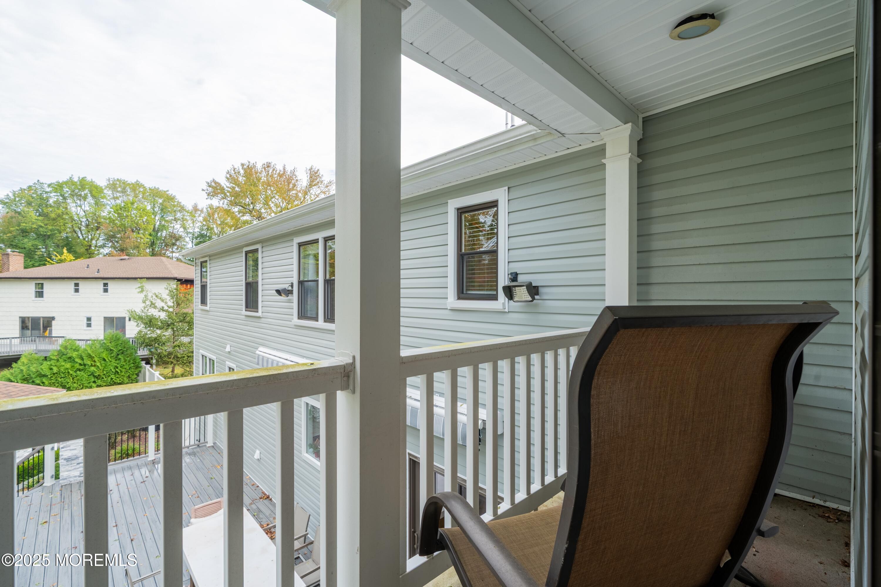 4 Garnet Street Morganville, NJ 07751 - Photo 26 of 70 a view of a balcony with furniture