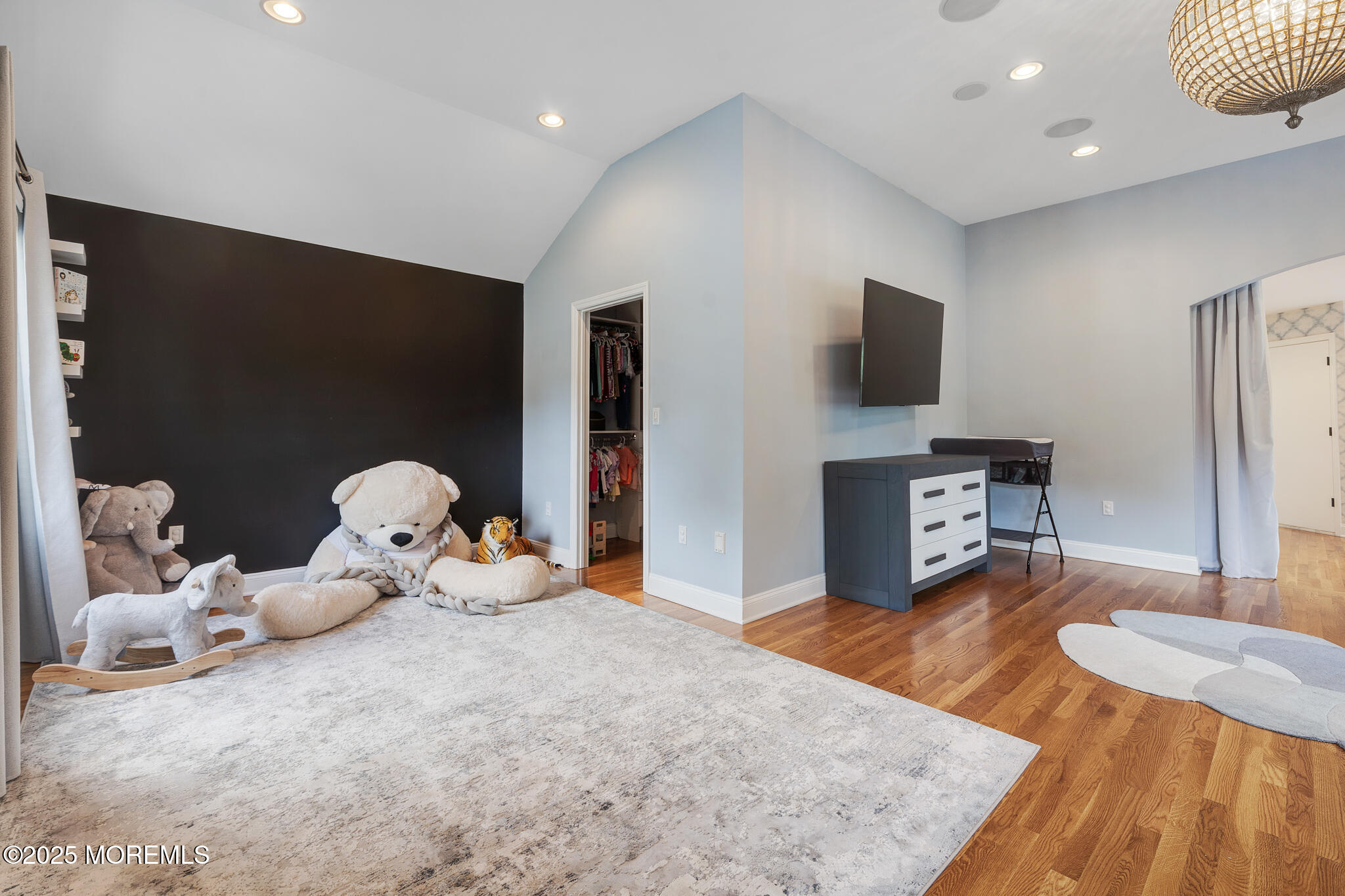4 Garnet Street Morganville, NJ 07751 - Photo 29 of 70 a living room with furniture and a flat screen tv