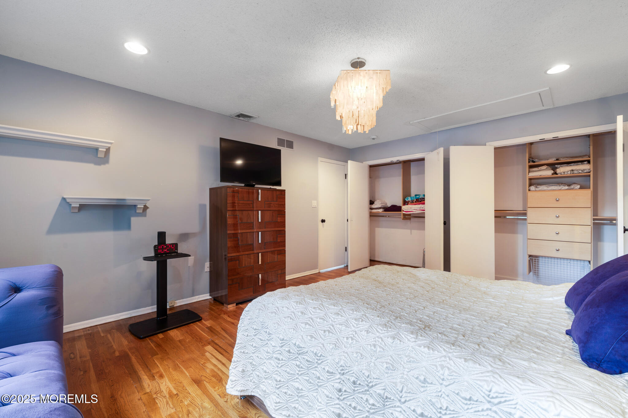 4 Garnet Street Morganville, NJ 07751 - Photo 35 of 70 a bedroom with a bed and wooden floor