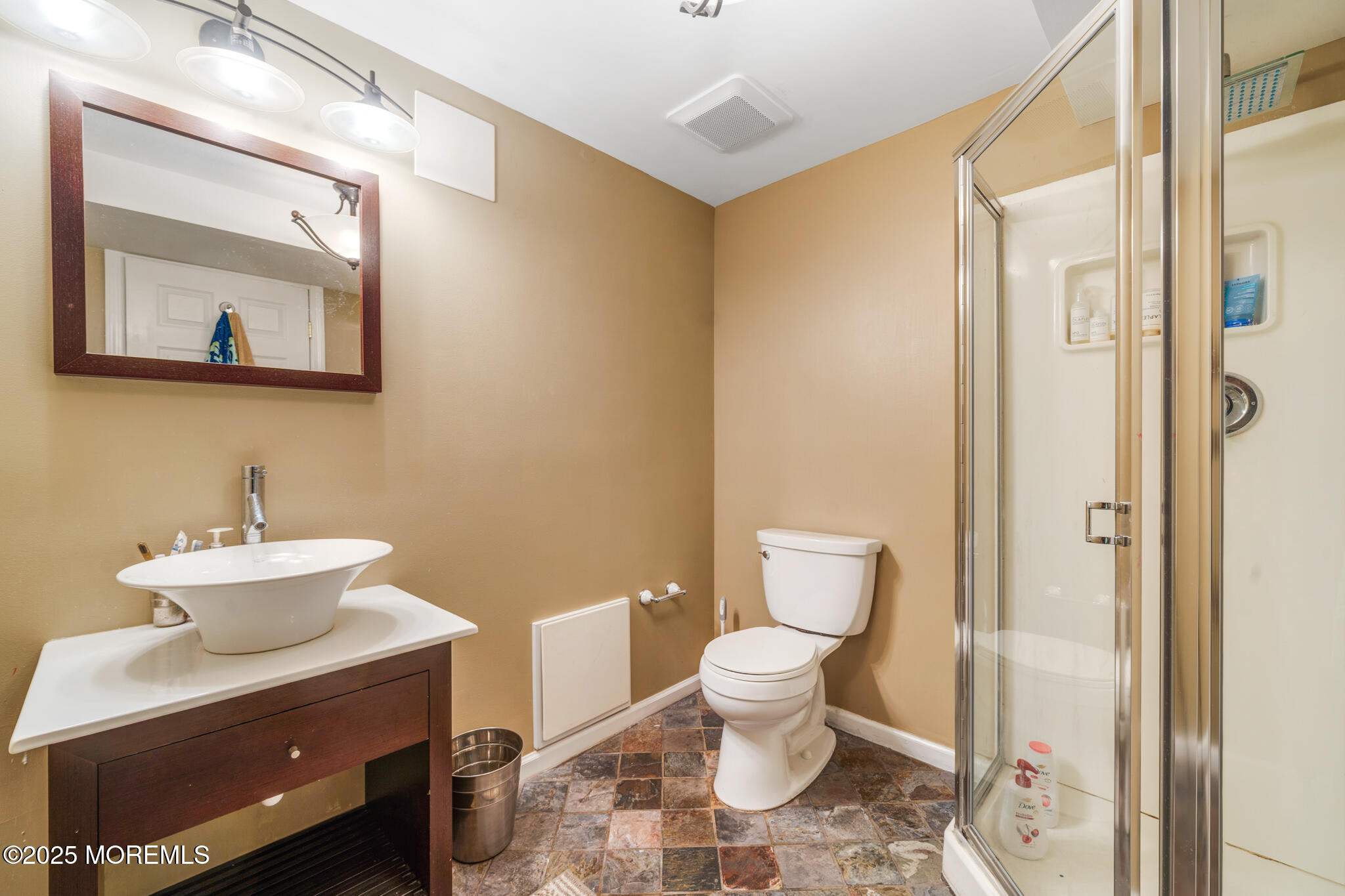4 Garnet Street Morganville, NJ 07751 - Photo 39 of 70 a bathroom with a toilet sink and mirror
